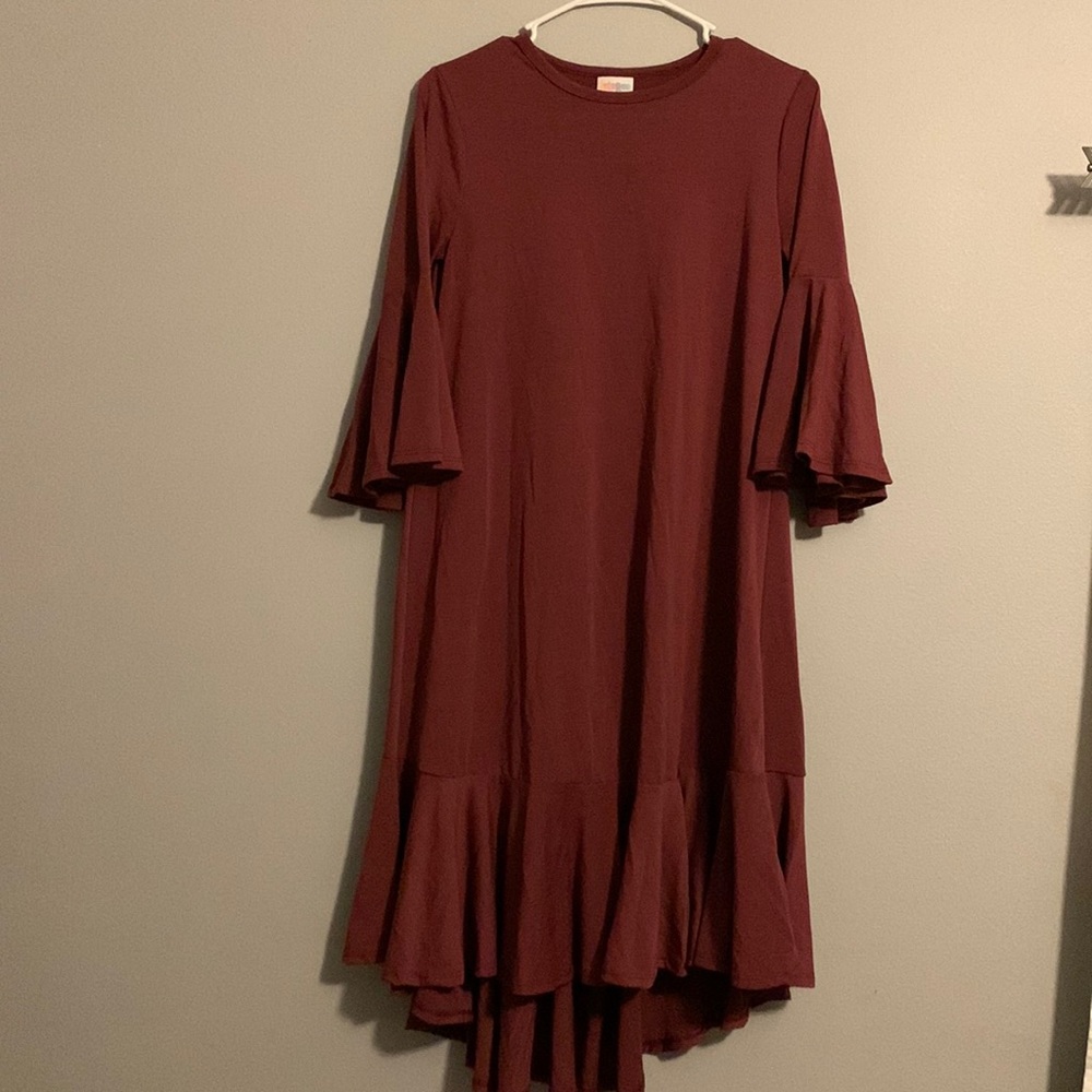 Bell sleeved dress with big ruffle around the bottom